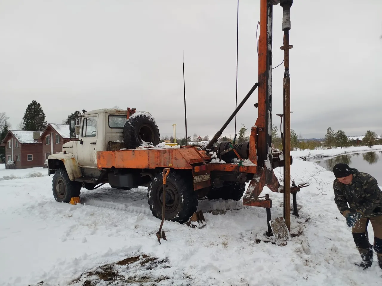 Drilling crew on site by a stream
