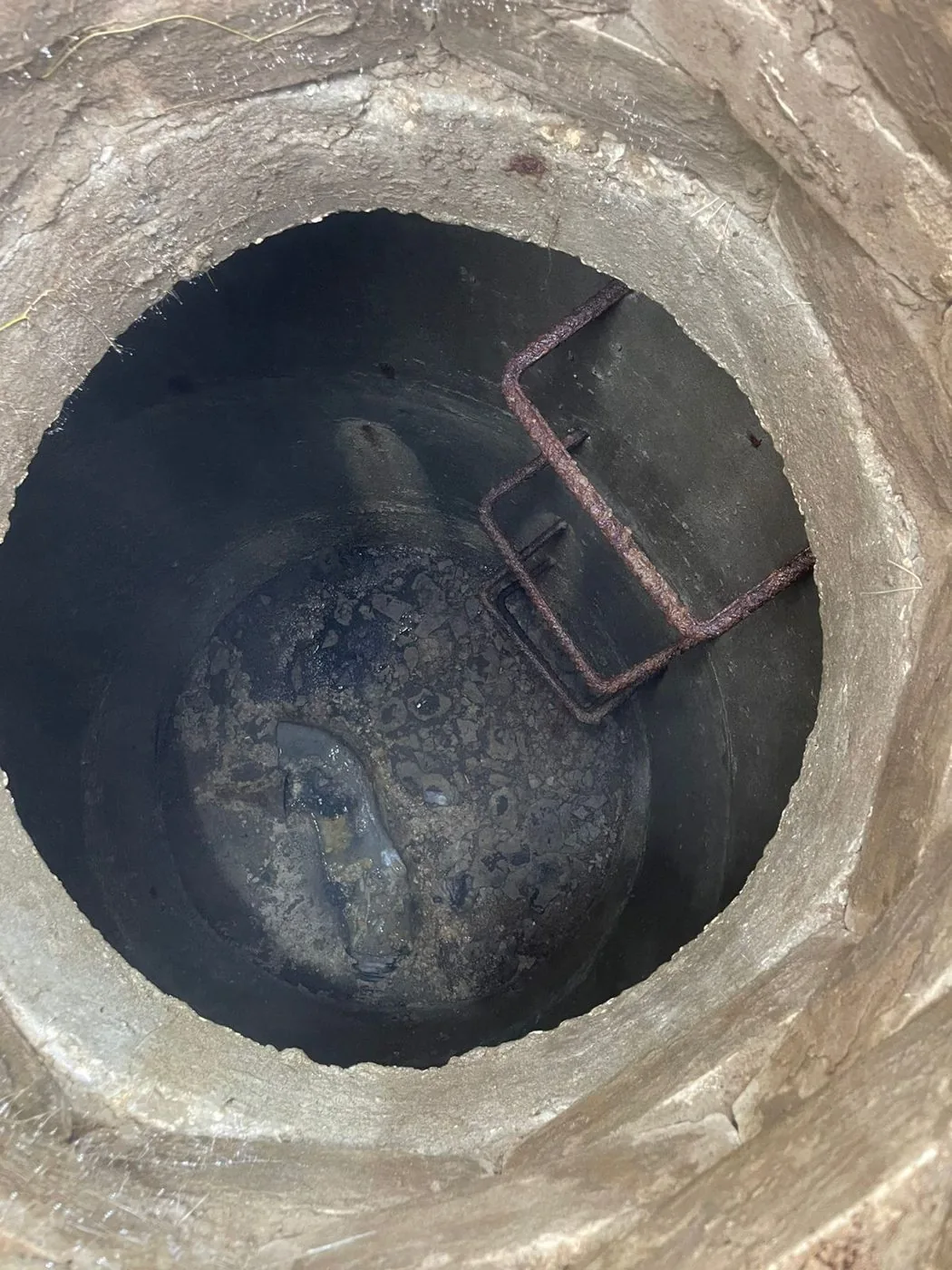 Opened underground utility chamber: depth measurements