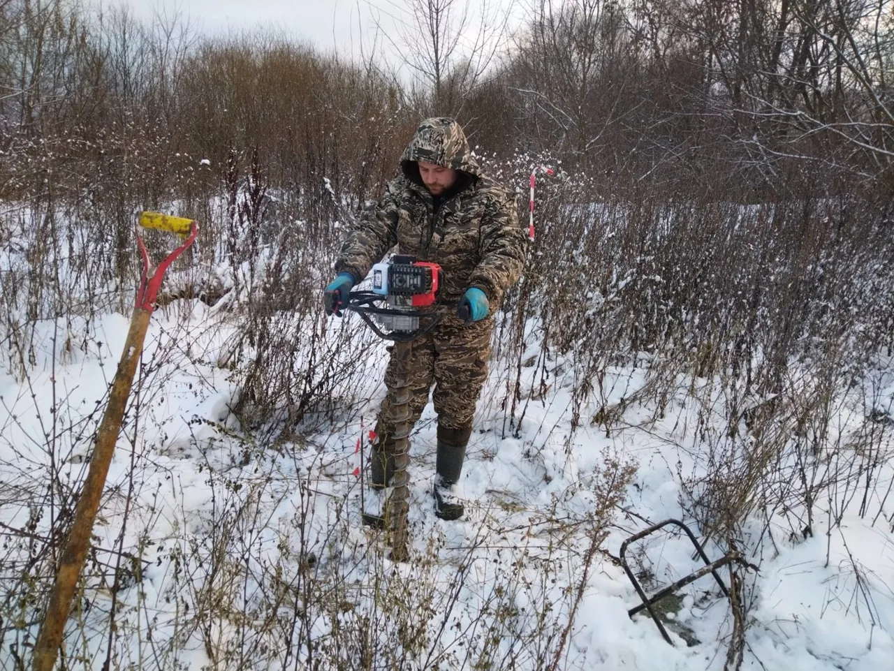 Installing a control network benchmark: borehole for a metal marker